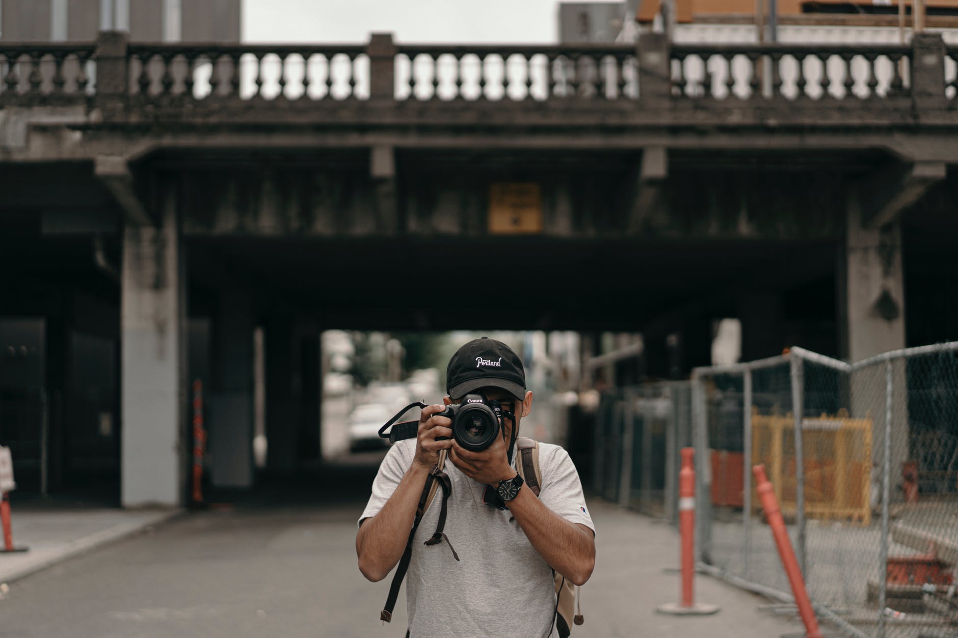 man taking photos with black dslr camera